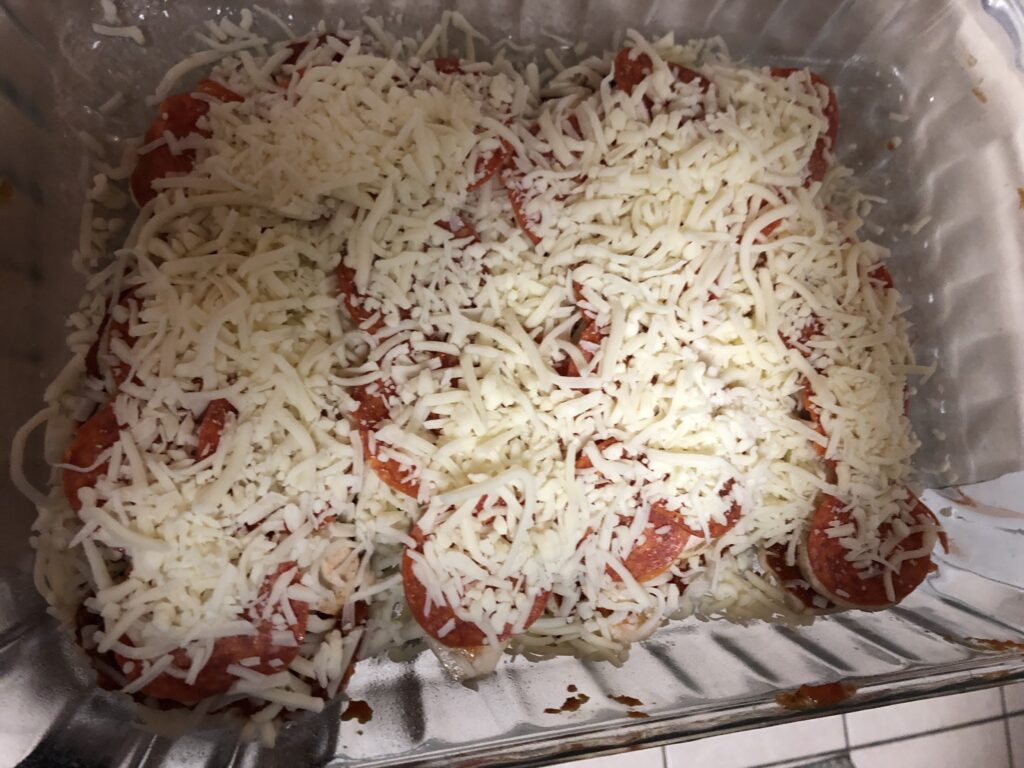 Low carb keto friendly pepperoni mushroom pizza chicken fully topped with mozzarella cheese